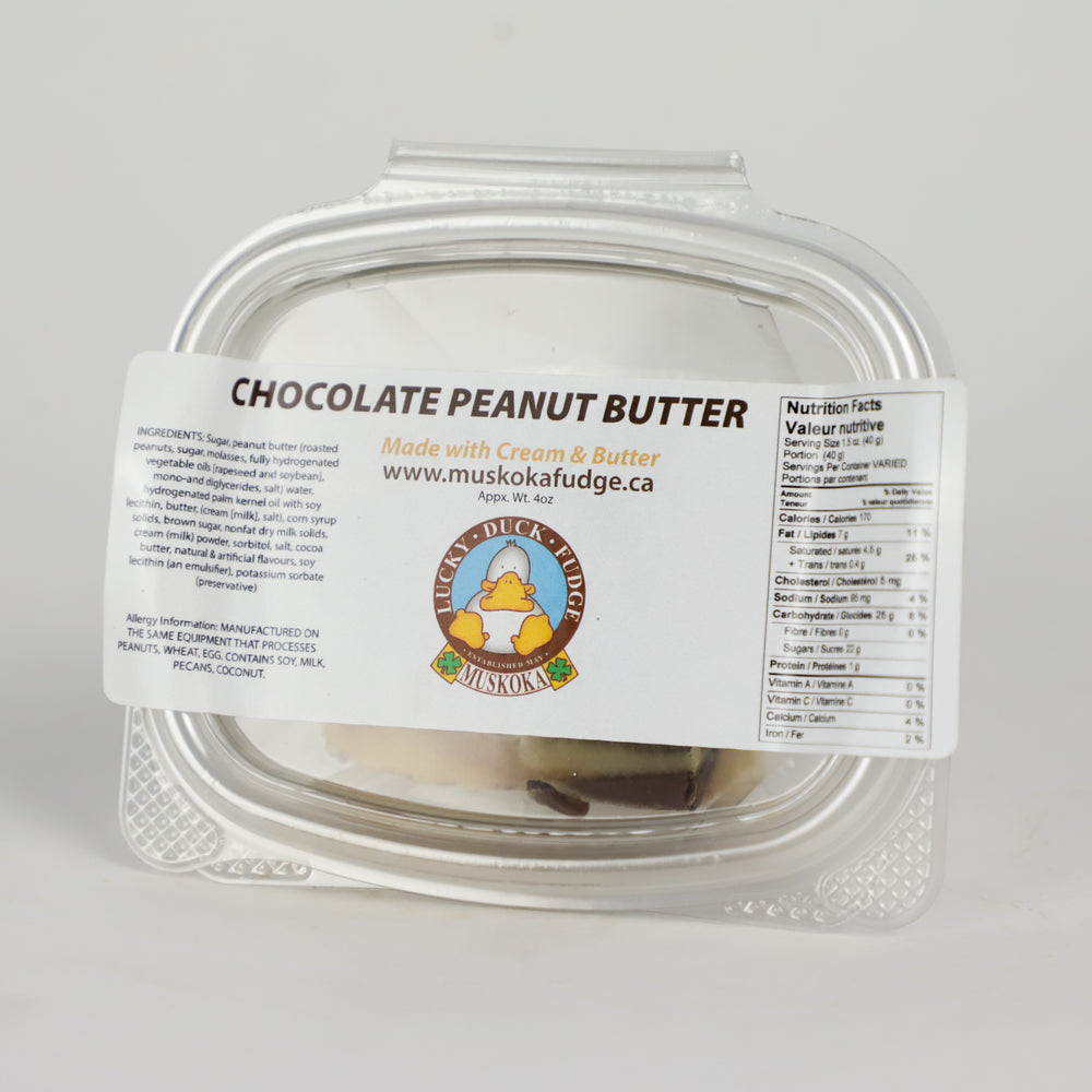 A quarter pound portion of Mint Chocolate Peanut Butter Fudge by Lucky Duck Fudge in a clear plastic tub and a label on the lid with the ingredients and nutritional facts.